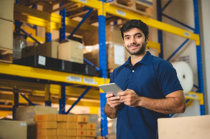 Male-warehouse-worker-portrait-in-warehouse-storage