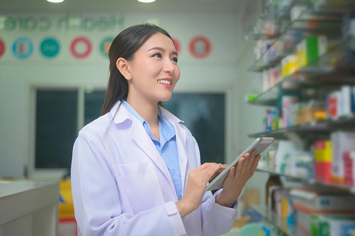 portrait-of-asian-woman-pharmacist-using-tablet
