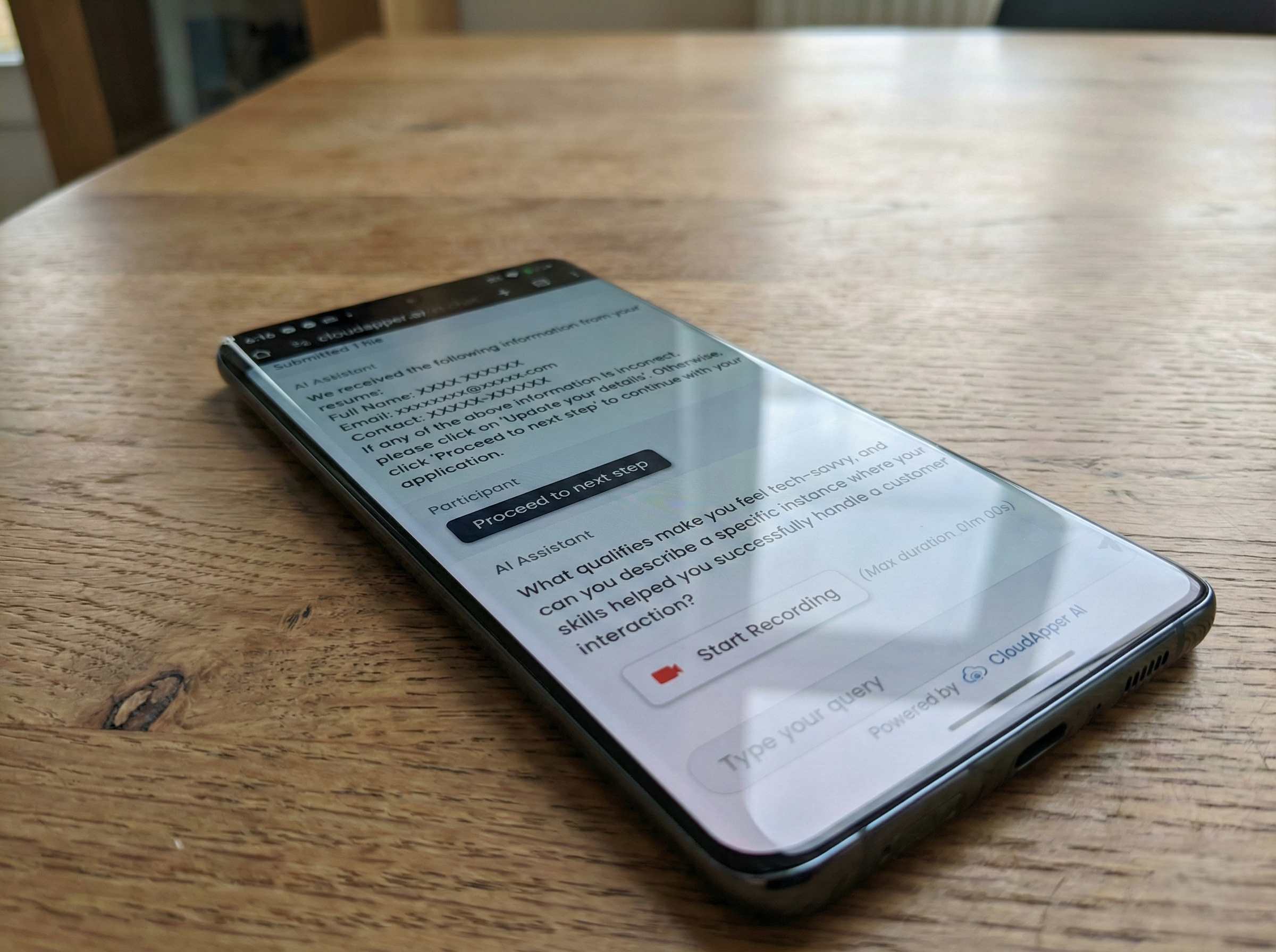 Candidate recording a one-way asynchronous video interview through a chatbot interface on a mobile device